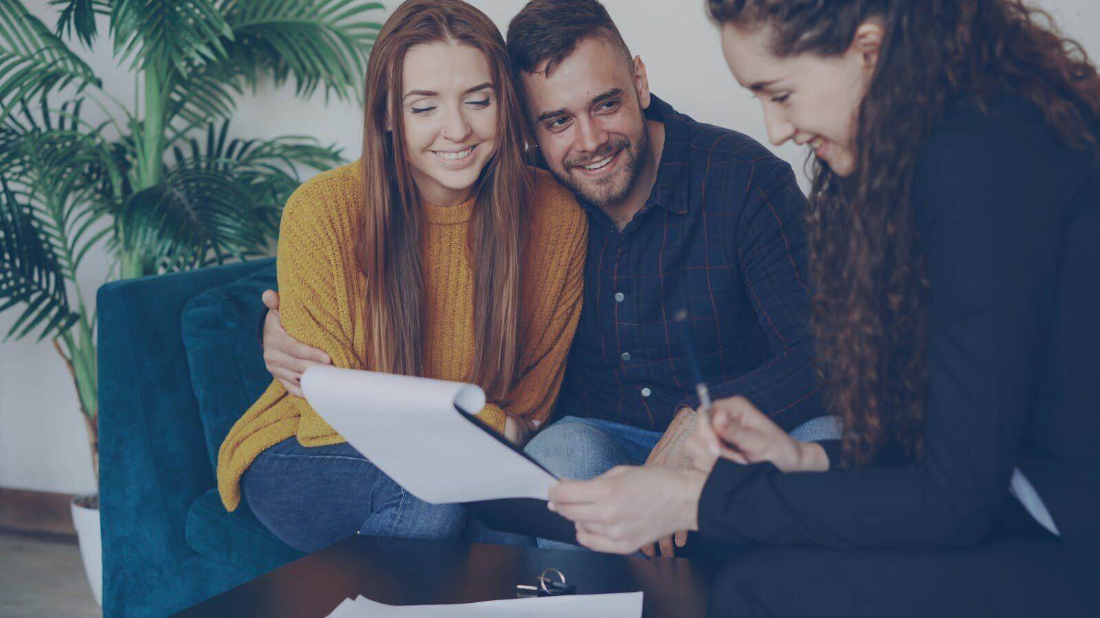 Advisor discussing documents with clients