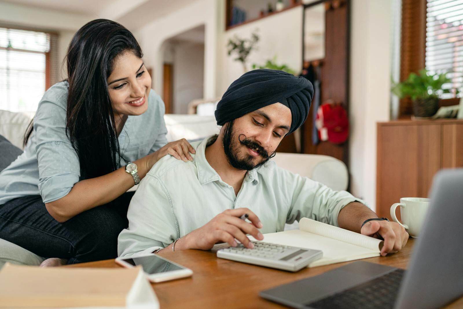 Couple reviewing investment portfolio at home